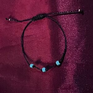 Turquoise 3bead friendship bracelet with black thread and 2 silver beads. New